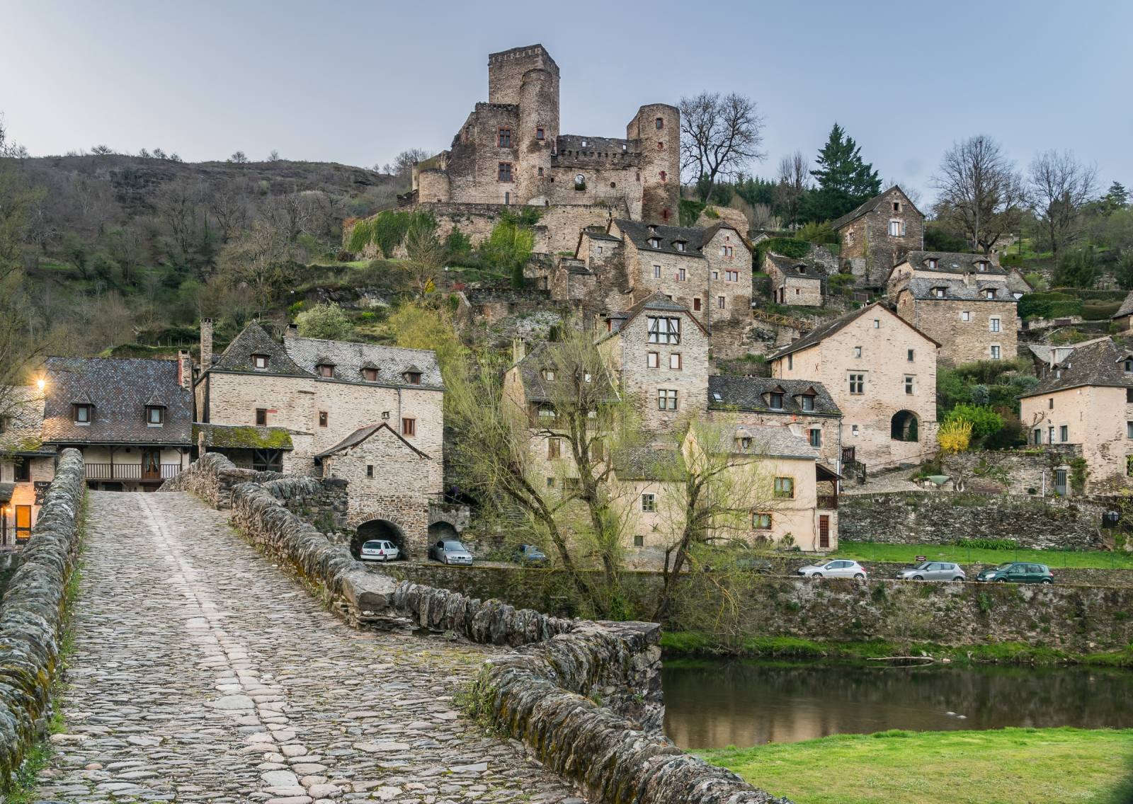 Belcastel castle overlooking the Gothic bridge and the Aveyron river