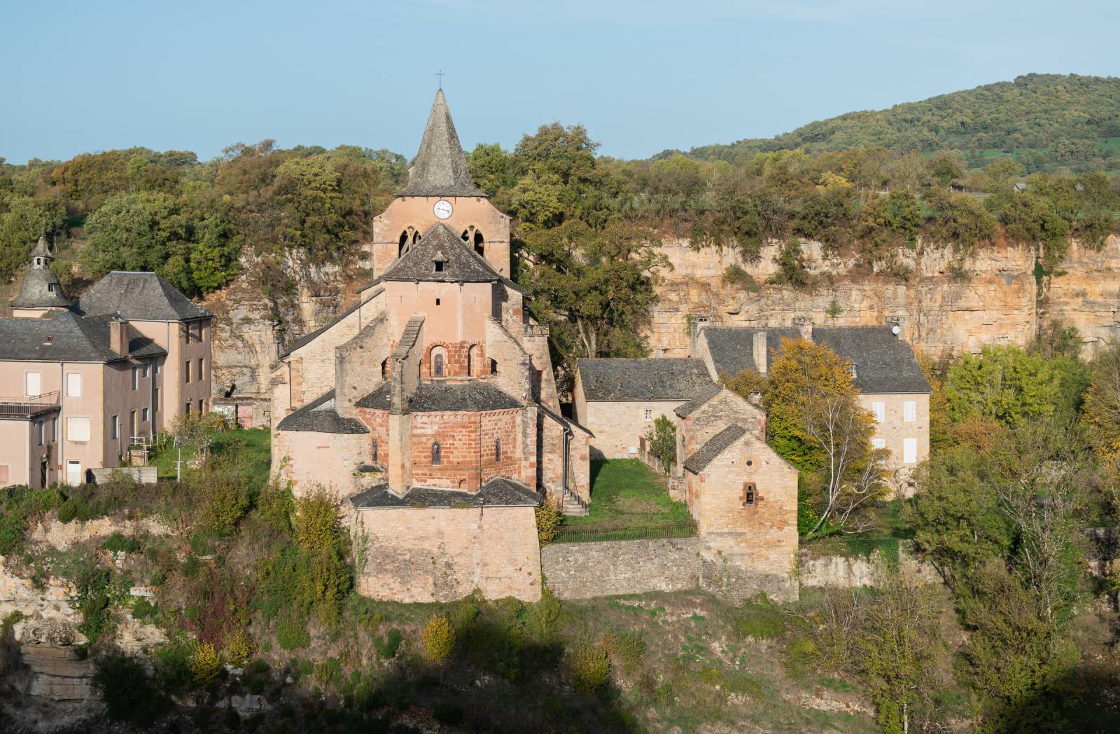 The Romanesque church of Sainte-Fauste in Bozouls, perched on its rocky spur in the heart of the horseshoe canyon, Aveyron