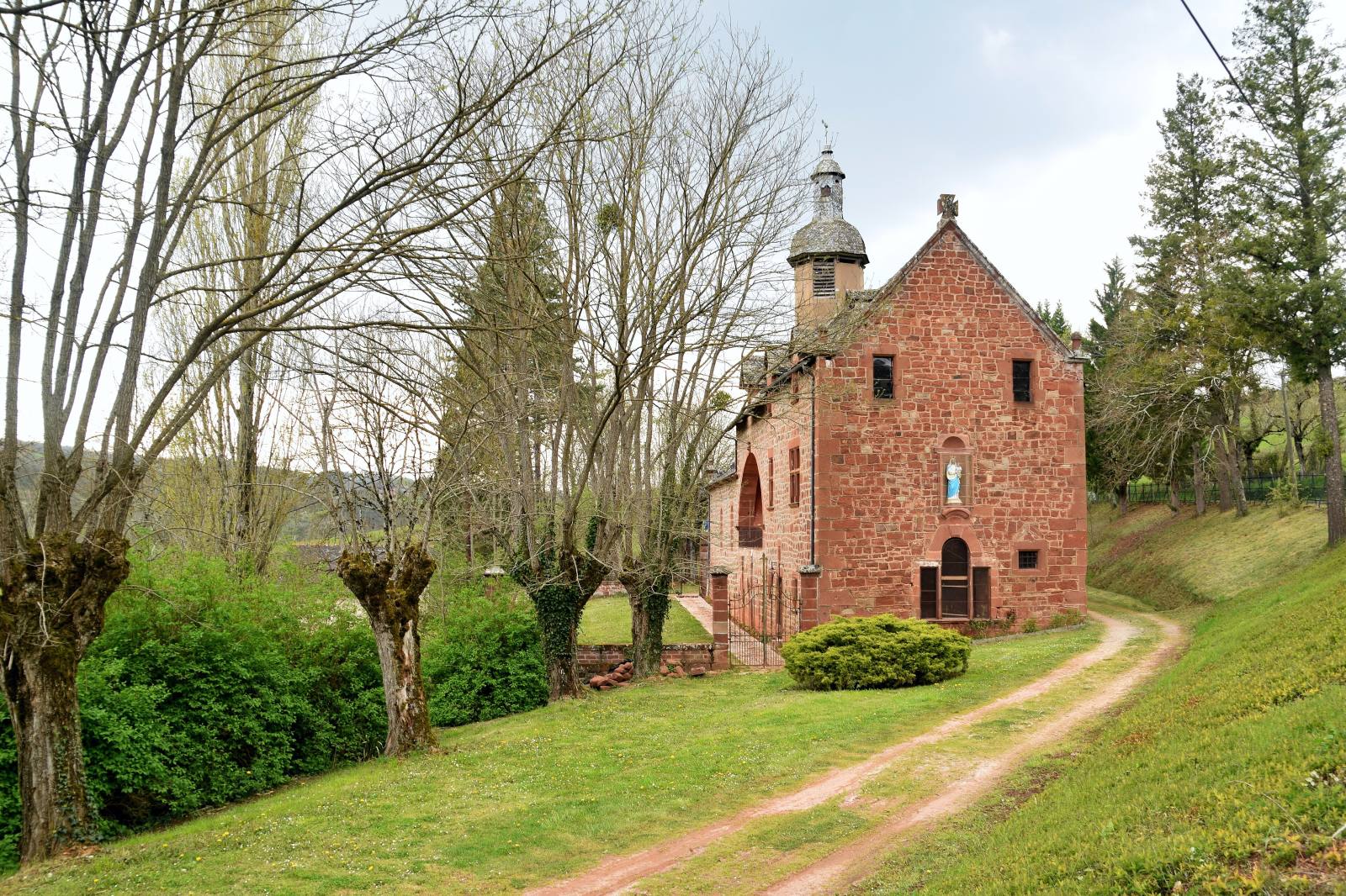 The red sandstone chapel of Notre-Dame de Foncourrieu and its bell turret, Marcillac-Vallon, Aveyron