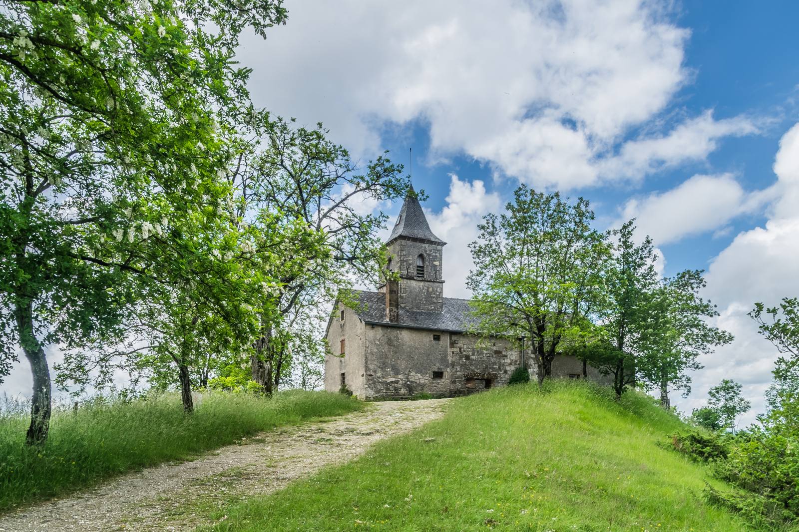 The Romanesque chapel of Saint-Jean-le-Froid on its hilltop, Mouret, Aveyron