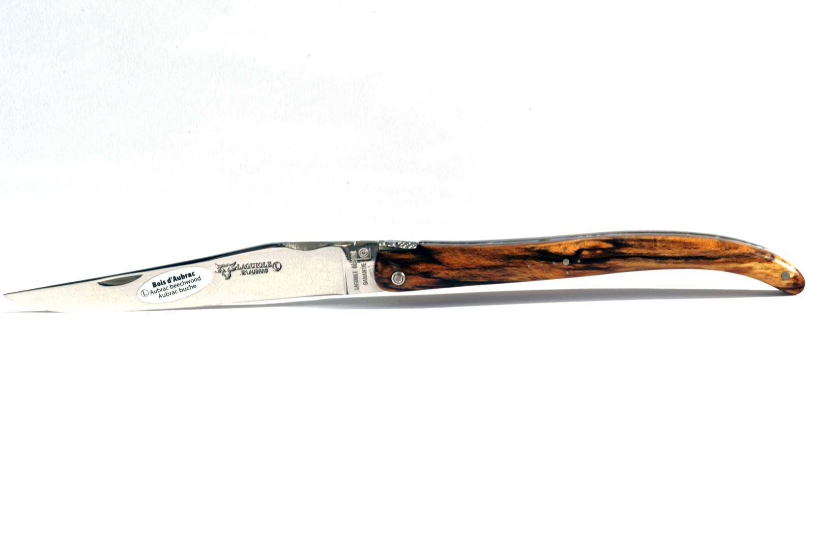 A Laguiole en Aubrac knife with an Aubrac wood handle and a blade engraved with a cow's head