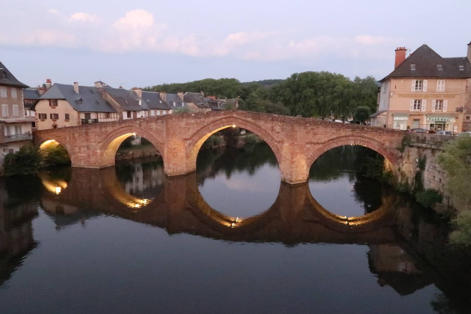 The Old Bridge of Espalion reflected in the Lot at dusk, Aveyron